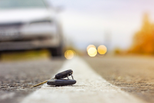 Lost car keys lying in the middle of the road